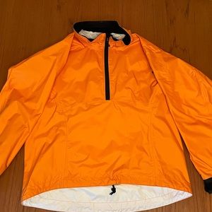 A women’s Lg kayak, 1/4 zip, waterproof, bright orange, anorak